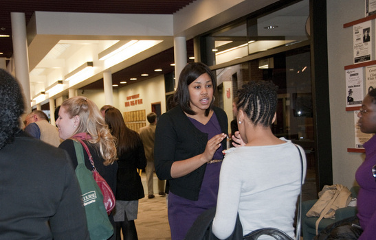 2008 graduate, Adrienne Cobb, speaks with a student during the 2010 Alumni Healthcare and Legal Professionals Weekend 