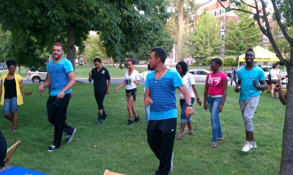 Members of ¡Muevete! Latin dance club demontrate dance moves on East College Lawn