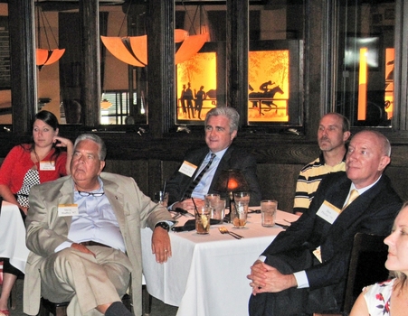 Indianapolis alumni listen intently to the speaker at a monthly networking lunch.