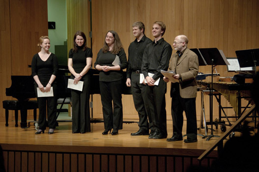 Aaron Jay Kernis with a vocal chamber group