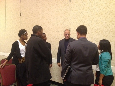 Depauw students with panelist  Tio Hardiman Director of Ceasefire & Violence Interrupter Intiative in Chicago asking questions and having discussion after the panel. 