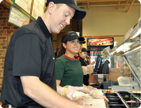 Reid Garlock '13 and Valeria Bermudez '13 examine Subway Client's needs by jumping in during their internship at Independent Purchasing Cooperative in Miami, FL