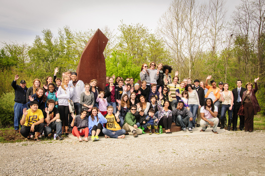 DePauw students, faculty, and staff gather for the re-dedication of Mark Warwick's sculpture "Reach"