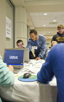 Greg Screws, Class of '13, assists Clark Wilson, Class of '15, at GIS Day