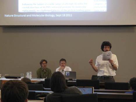 Professor Dan Gurnon (right) presenting his paper "Ethics of Crowd-Sourcing Solutions to Scientific Problems"