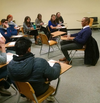 Students working with Kyle Moore '11 during our No Harm in Charm event.