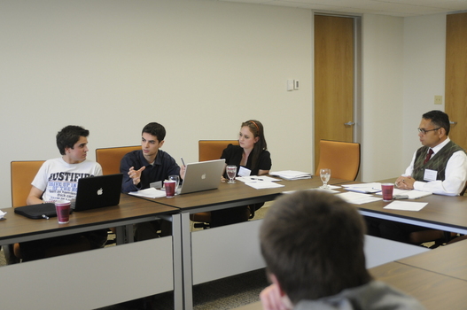 Andrew Forcehimes (Pepperdine University, left), Andrew Maddocks '11 (center) and Nicki Hewell '11 (right) debating during a workshop