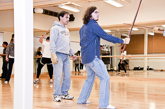 Prof. Andrew Hayes instructs students in the fencing styles of Shakespeare