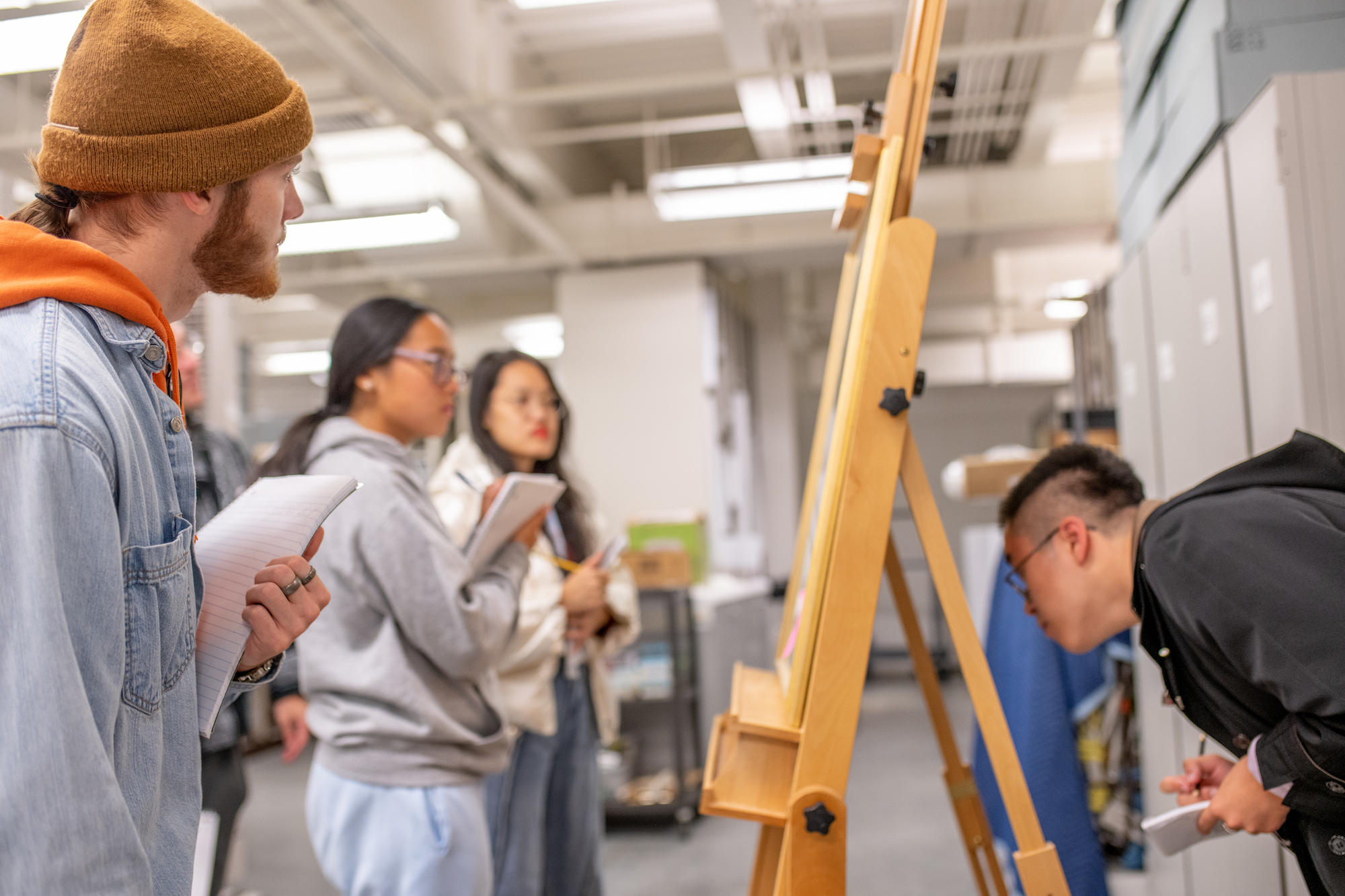 students discuss paintings