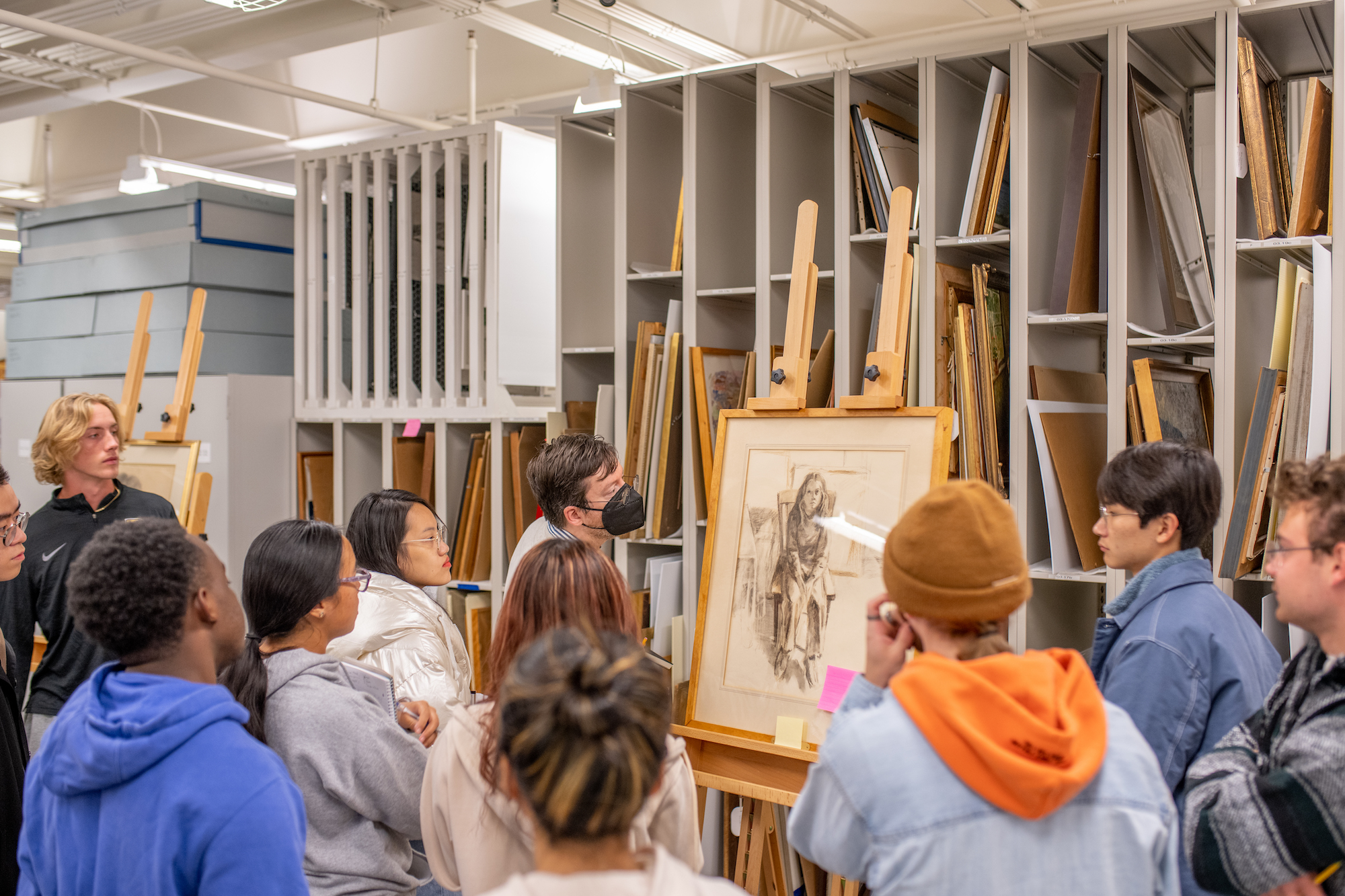 art prof John Berry leads discussion on paintings