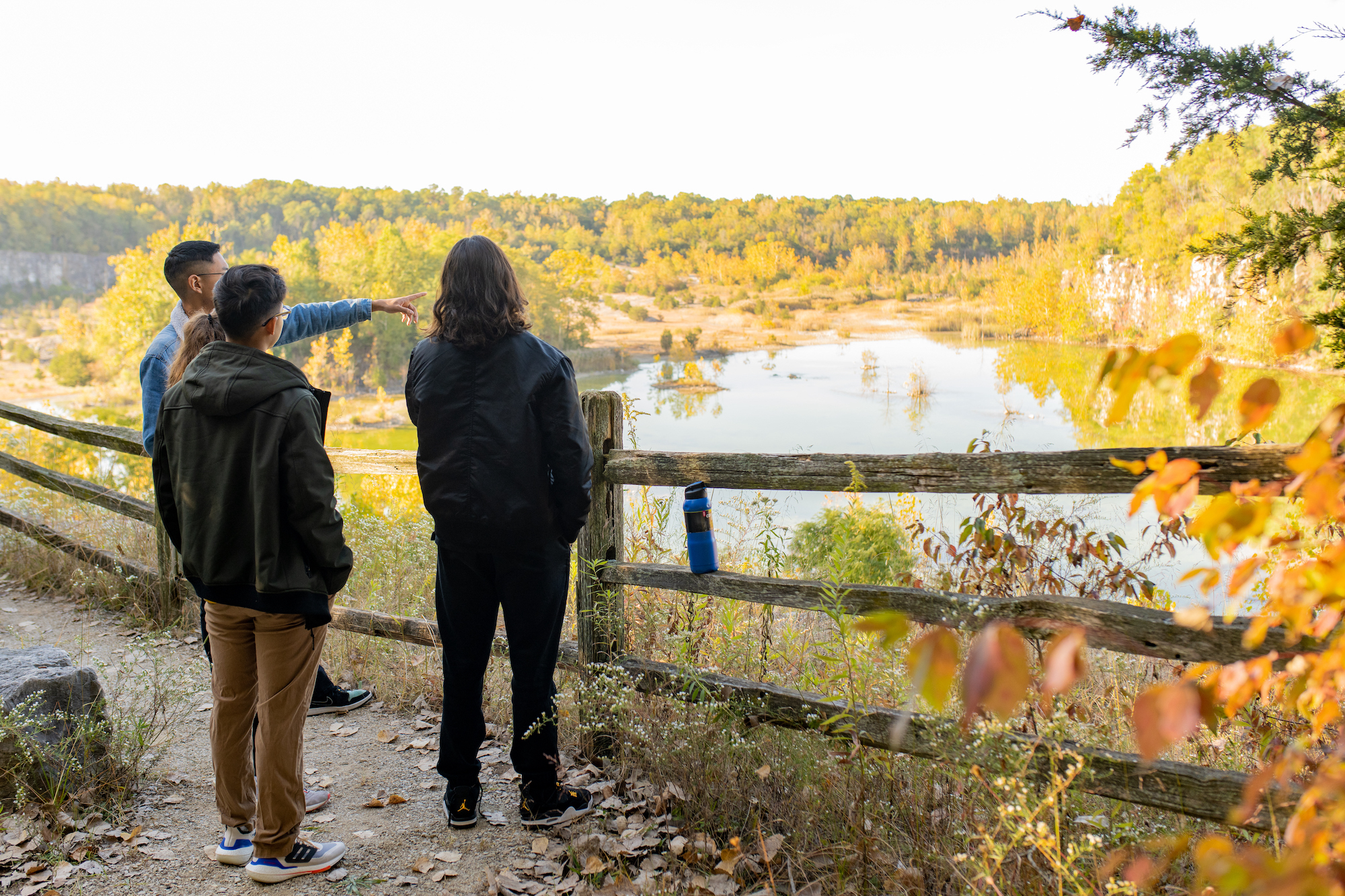 students looking out at quarry in nature park