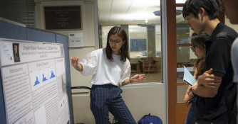 Student presenting at the Science Poster Session