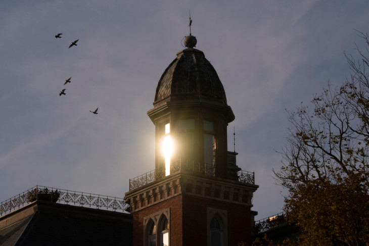 Sun reflects on clock tower