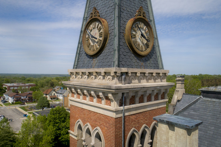 The clock tower in the foreground of a drone shot