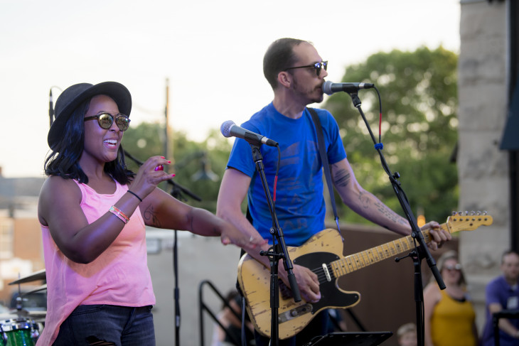 singer and musicians on stage outside