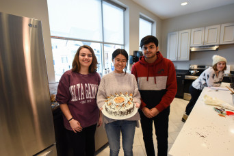 Students with a cake