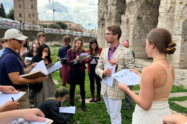 Andrew Conarty ’24 gives a lecture, or “site report,” about the Theater of Marcellus to peers and professors during his study abroad experience.