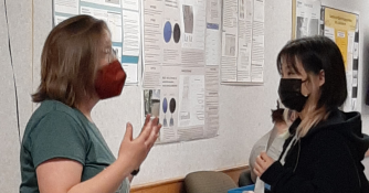 Student talking with professor