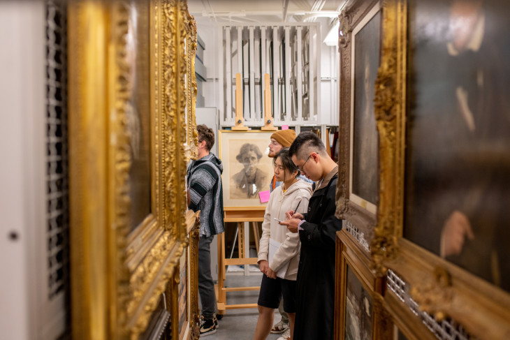 First Year Seminar class walking through a gallery