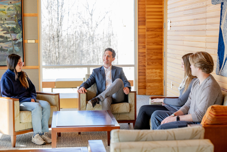 Professor Jeff Dunn and students seated inside the JANET PRINDLE INSTITUTE FOR ETHICS