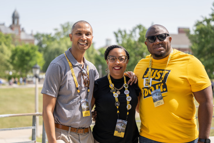 3 Alumni smiling together