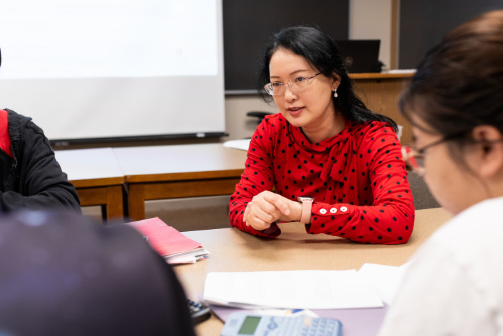 Zhixin Wu in the classroom with students