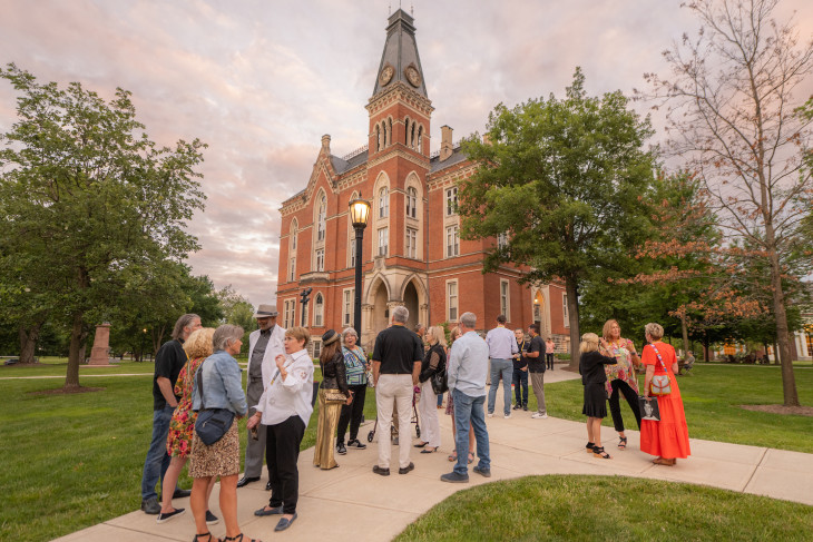 Alumni celebrating Alumni Reunion Weekend in front of East College