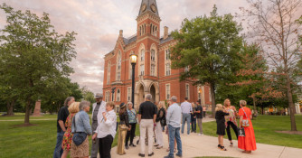 Alumni celebrating ARW in front of East College