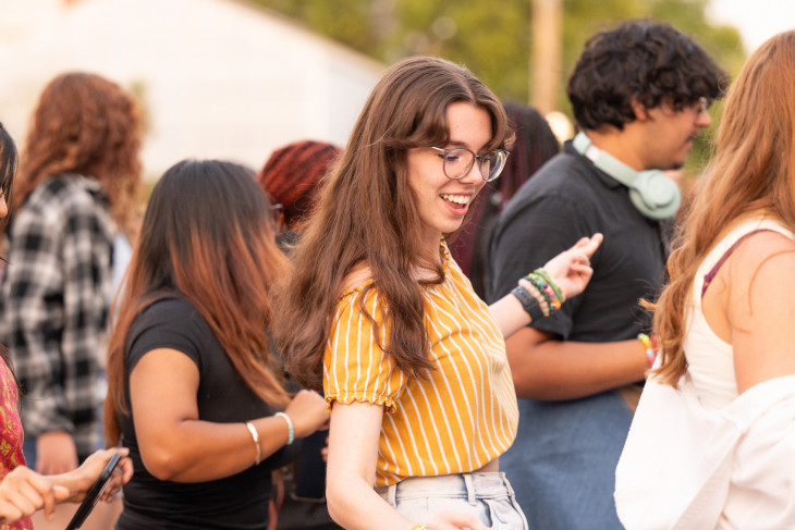 Student Amelia Roser dances at block party