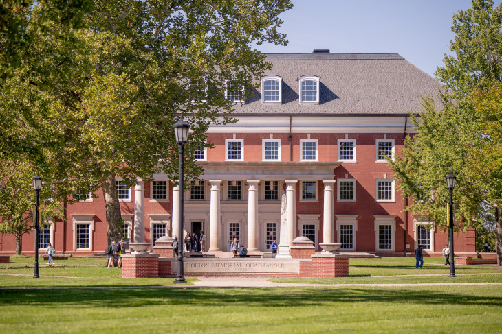 Students walk in front of Roy O. West Library