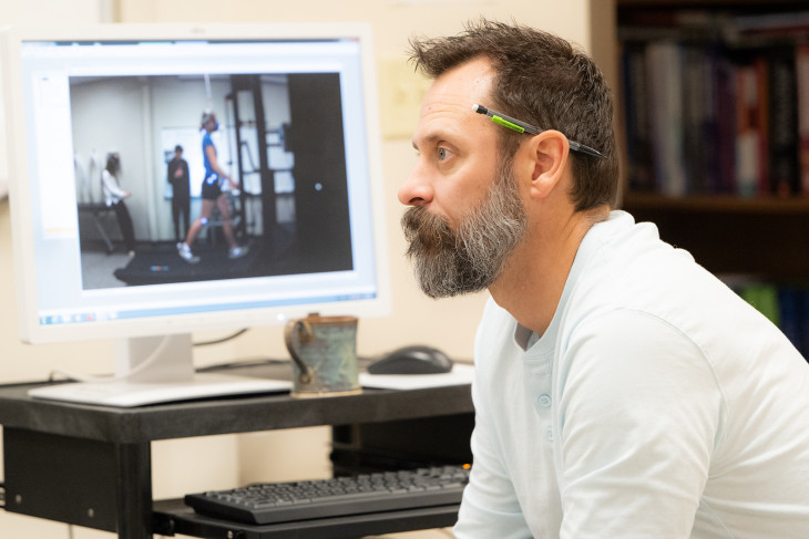 Brian Wright listens to students in the lab