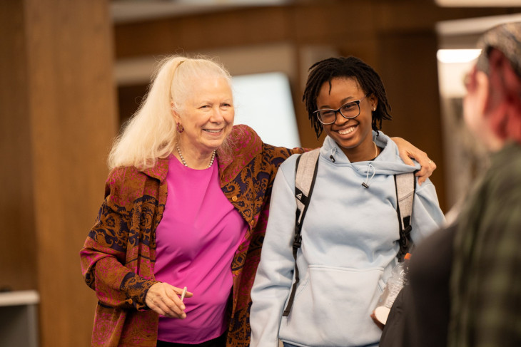 Gloria Townsed laughs with student