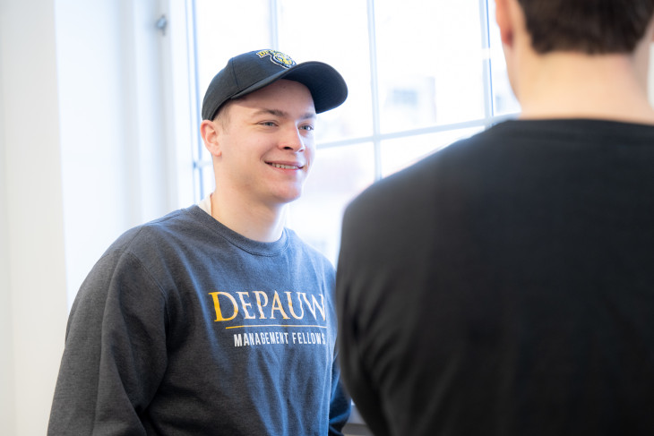 Student Wyatt Brewster talks with a classmate