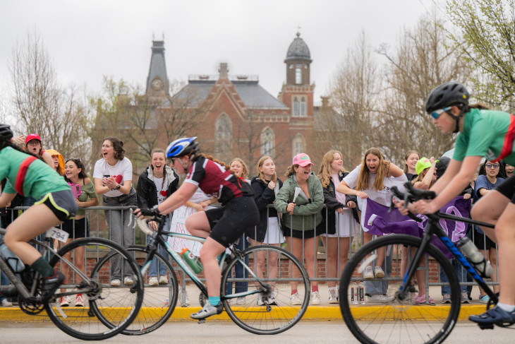 Riders compete in bike race as fans cheer them on