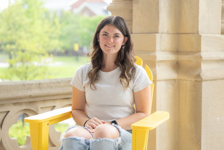 Student Ava Lehmkuhler on steps of East College