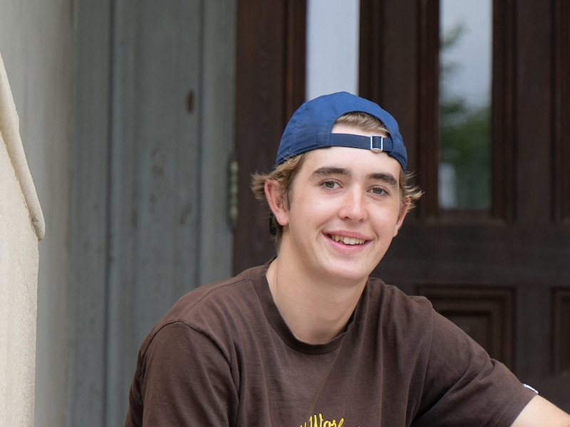 Tanner Austin on the steps of East College