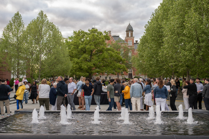 Families gathered around the fountain during the Under the Stars event