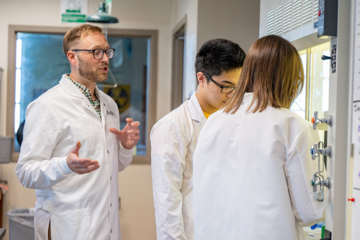 Students with faculty in lab