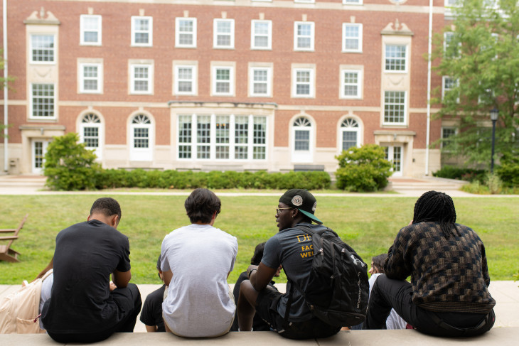Students sit on steps overlooking Ubben Quad