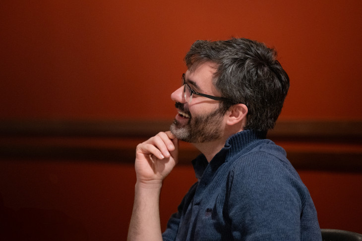 Professor Tim Barr laughs while watching student presentations