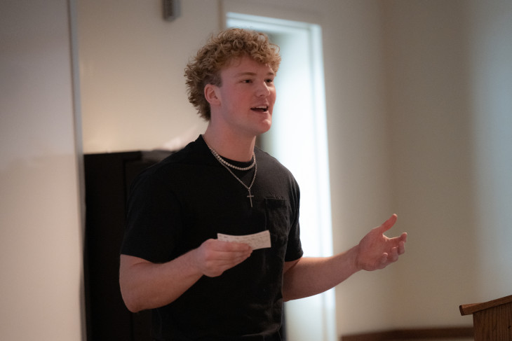 Student speaks at front of classroom