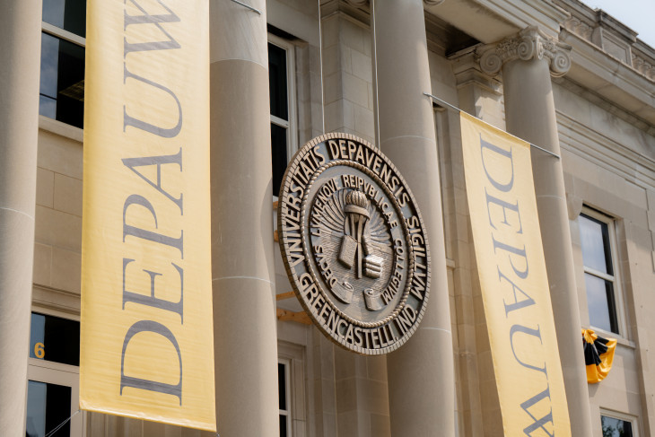 University seal with gold banners