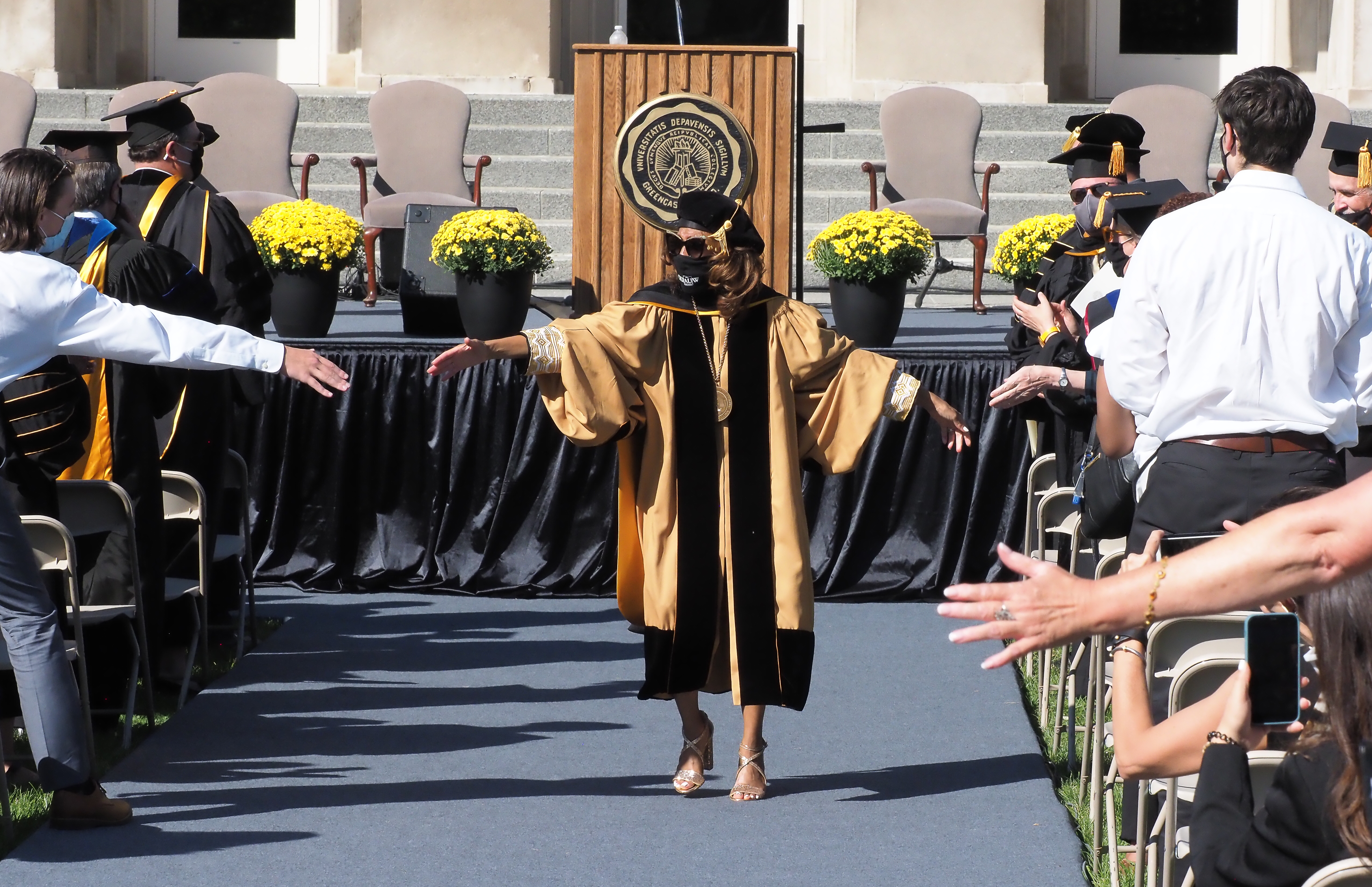 Dr. White greets well-wishers as she leaves her inauguration ceremony.