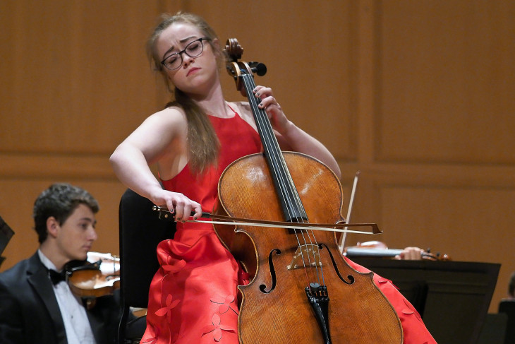 A woman playing a cello