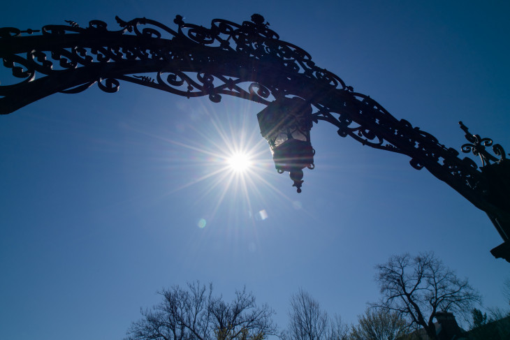 Sun behind the arch