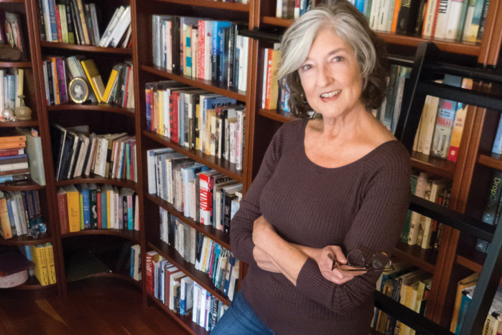 Barbara Kingsolver ’77 in front of book shelves