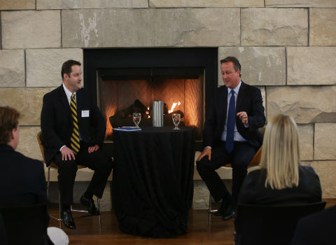 History Professor Robert Dewey conducting a student forum with former British Prime Minister David Cameron