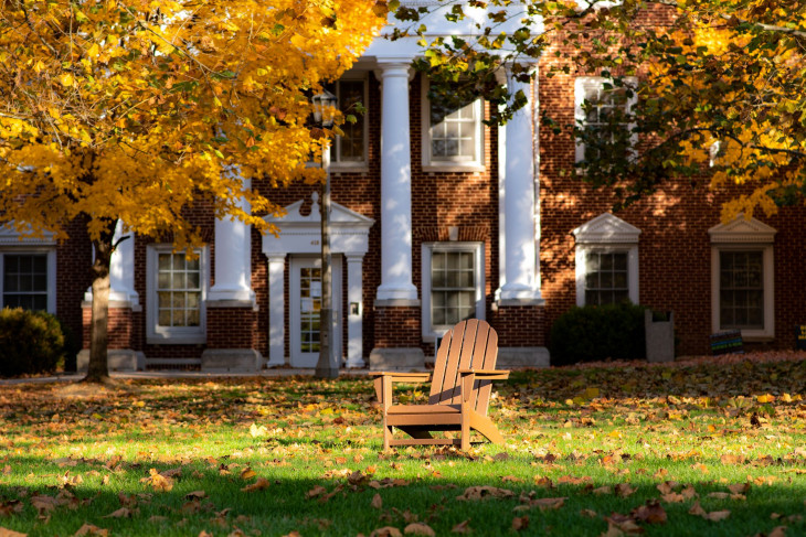 Colorful trees in front of campus building.