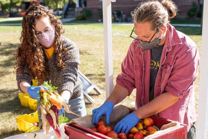 Students staff the farmstand. 