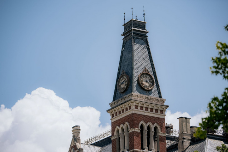 East College's bell tower on a blue sky day. 